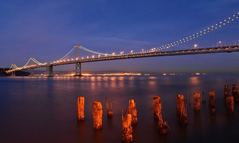 Обои ночь, огни, вода, панорама, мост, сан-франциско, bay bridge, бэй бридж, night, lights, water, panorama, bridge, san francisco разрешение 1920x1200 Загрузить