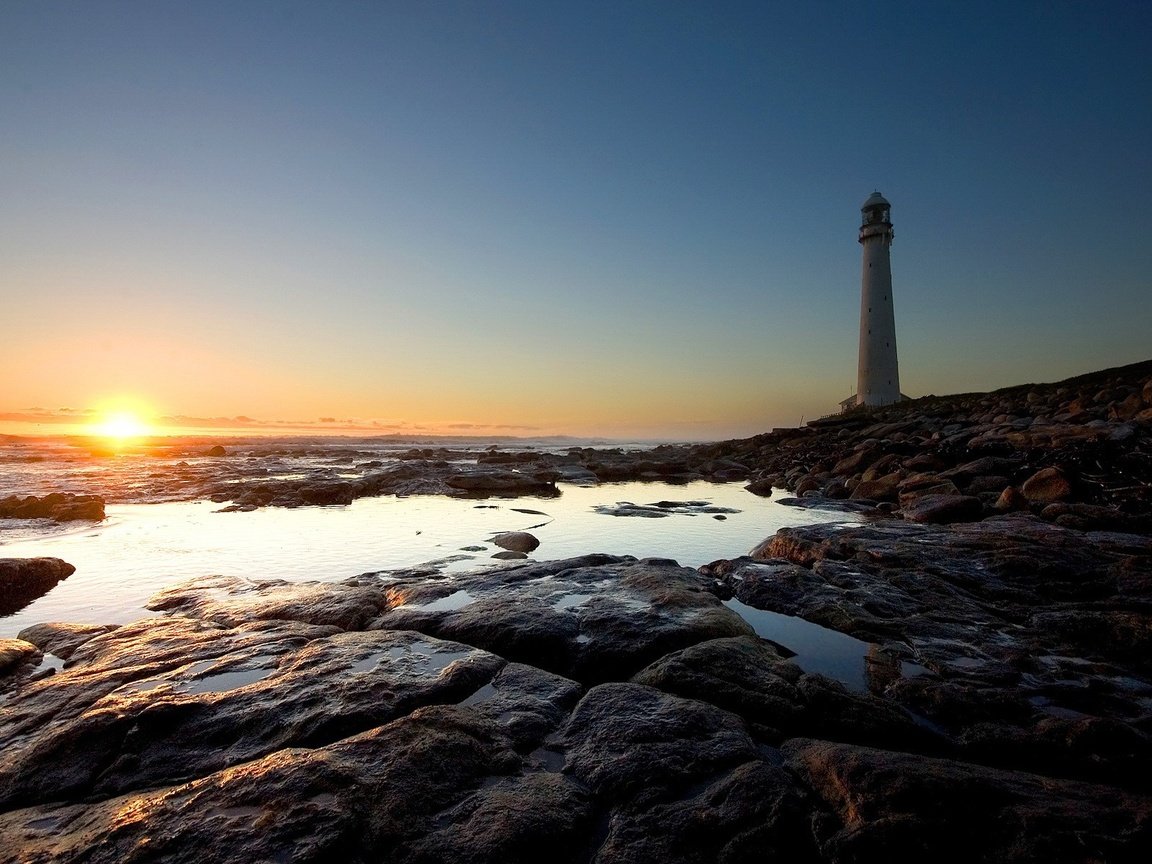 Обои солнце, камни, берег, маяк, the sun, stones, shore, lighthouse разрешение 1920x1200 Загрузить