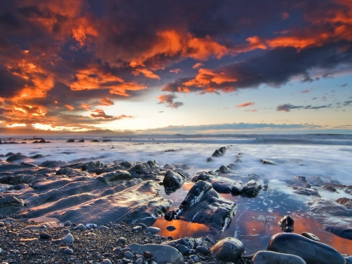 Обои небо, камни, берег, закат, тучи, море, побережье, the sky, stones, shore, sunset, clouds, sea, coast разрешение 1920x1080 Загрузить