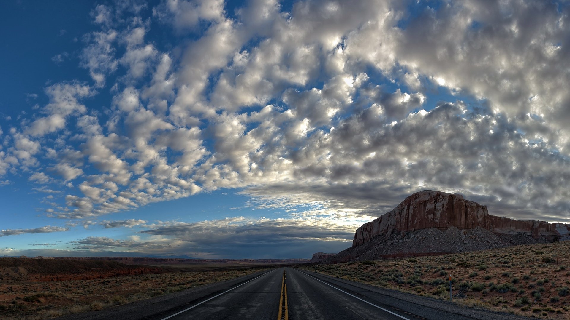 Обои небо, дорога, облака, природа, пейзаж, поле, пустыня, гора, the sky, road, clouds, nature, landscape, field, desert, mountain разрешение 2048x1110 Загрузить