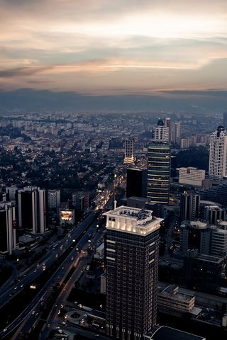 Обои вечер, город, небоскребы, дома, сумерки, улицы, the evening, the city, skyscrapers, home, twilight, street разрешение 1920x1200 Загрузить