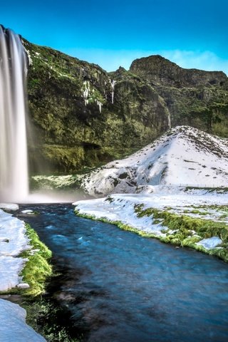 Обои трава, скалы, снег, мост, водопад, исландия, селйяландсфосс, grass, rocks, snow, bridge, waterfall, iceland, seljalandsfoss разрешение 3840x2160 Загрузить