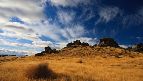 Обои небо, холмы, природа, камни, растения, пейзаж, поле, травы, the sky, hills, nature, stones, plants, landscape, field, grass разрешение 1920x1200 Загрузить