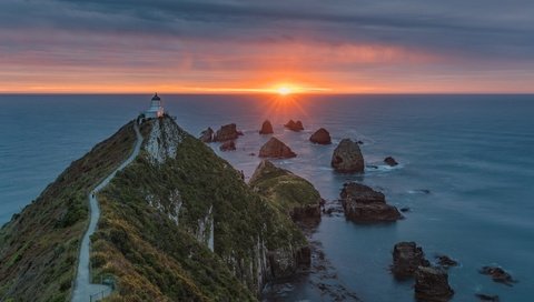 Обои скалы, закат, пейзаж, море, маяк, мыс, rocks, sunset, landscape, sea, lighthouse, cape разрешение 1920x1080 Загрузить