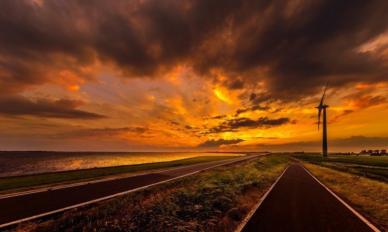 Обои небо, дорога, облака, закат, море, ветряк, the sky, road, clouds, sunset, sea, windmill разрешение 2647x1440 Загрузить