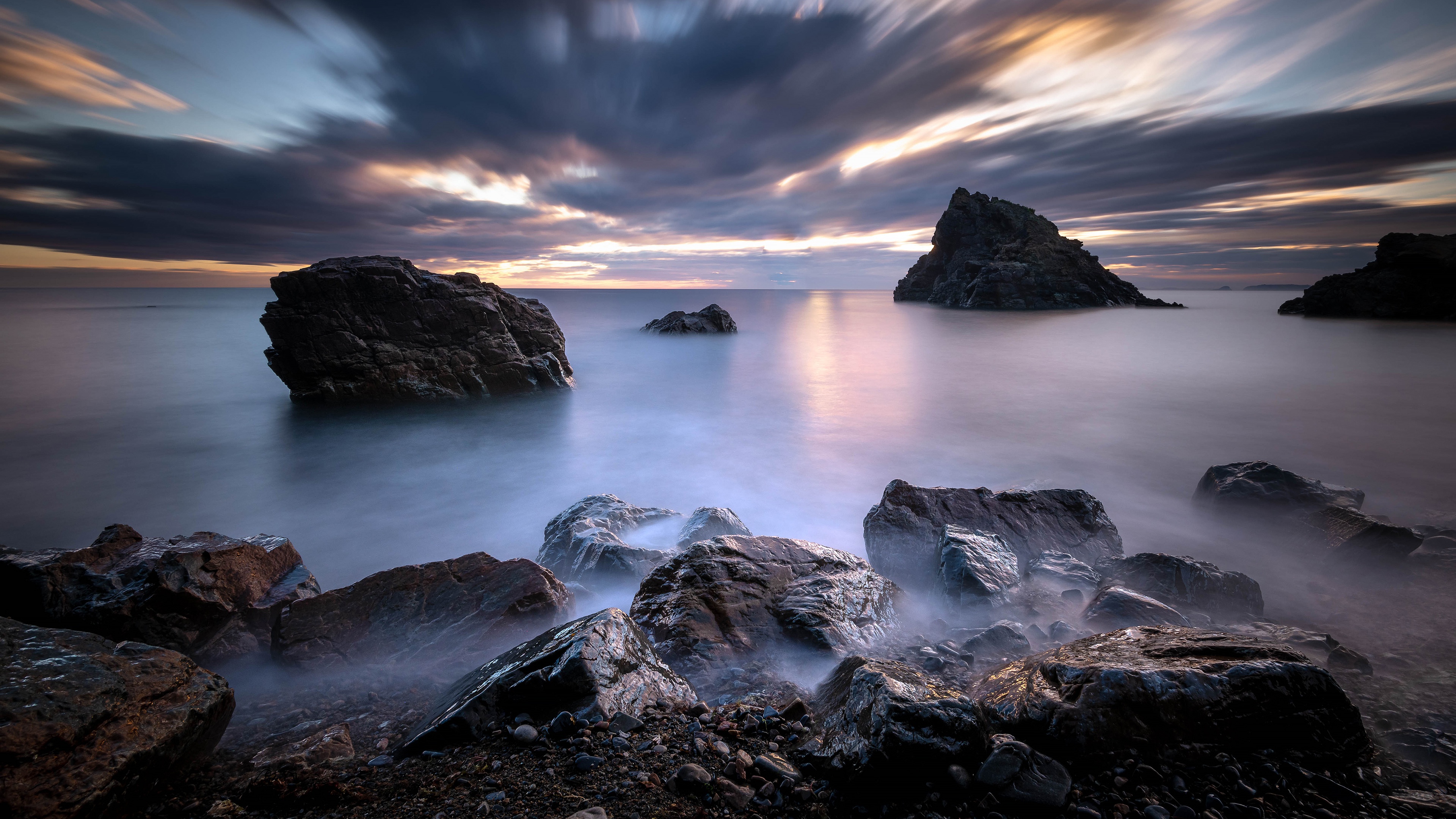 Обои небо, облака, скалы, камни, берег, закат, море, the sky, clouds, rocks, stones, shore, sunset, sea разрешение 3840x2160 Загрузить